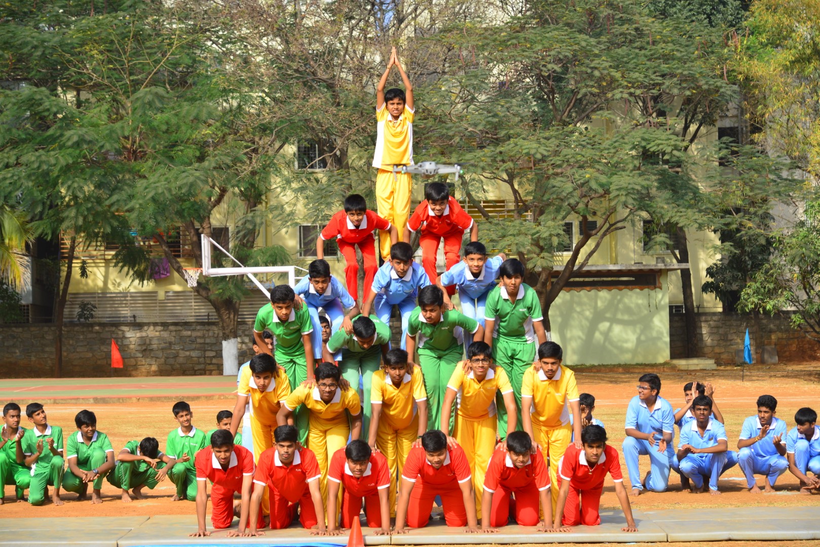 A group of students from Bethesda International School in Bangalore forms a human pyramid during Sports Day, showcasing teamwork and athleticism.